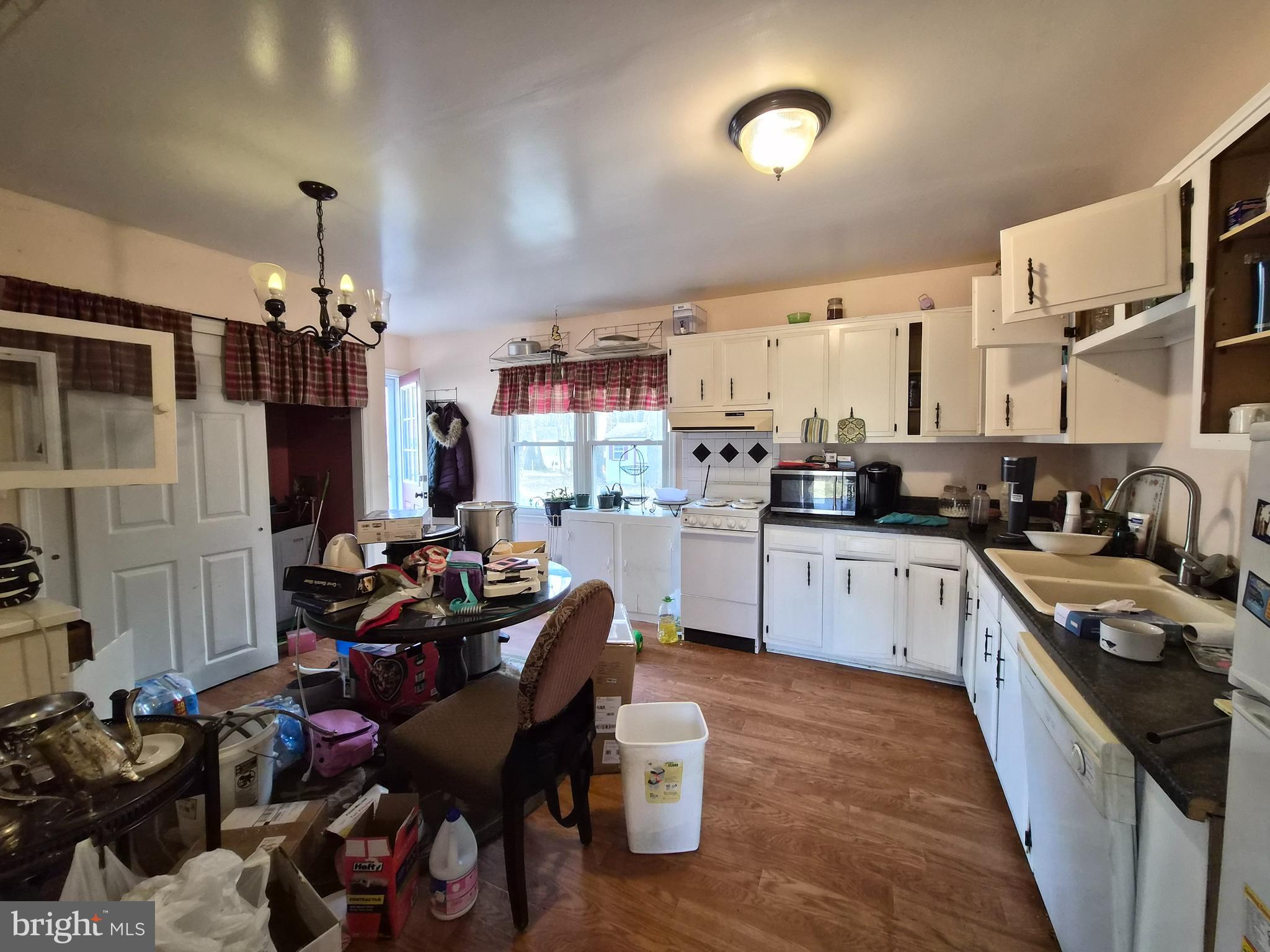 6401 Towles Mill Road Spotsylvania, VA 22551 - Photo 5 of 19 a kitchen that has a lot of cabinets a sink and a stove