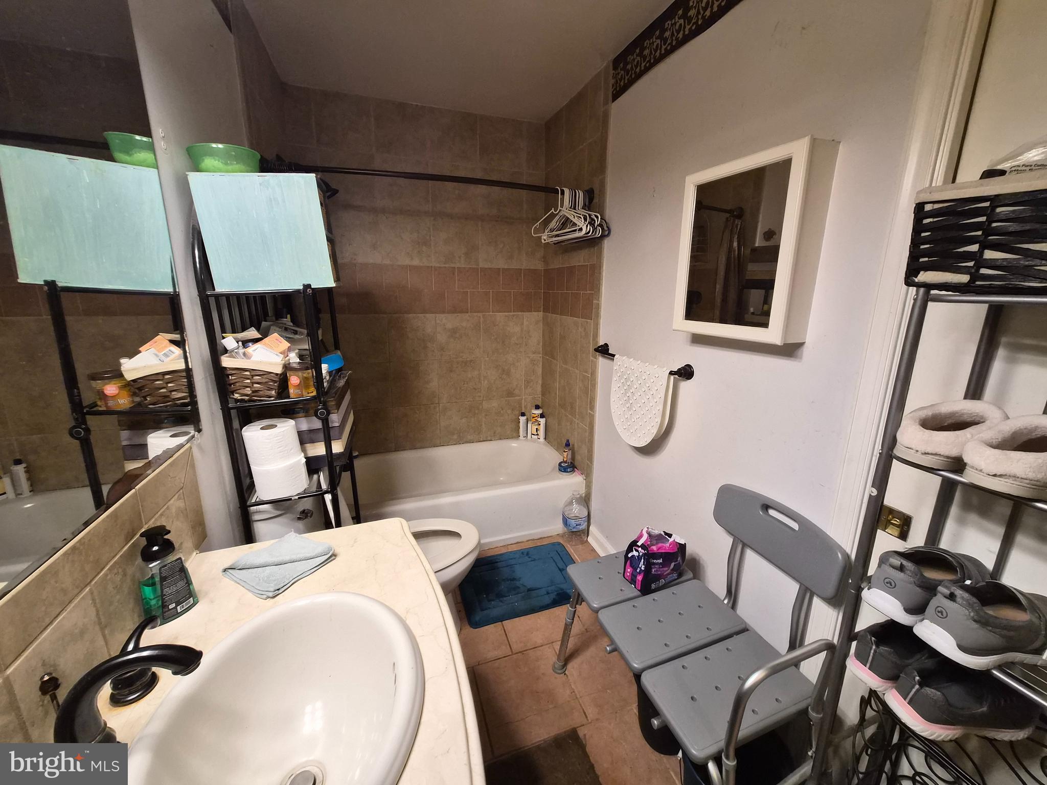 6401 Towles Mill Road Spotsylvania, VA 22551 - Photo 10 of 19 a bathroom with a sink mirror toilet and bathtub