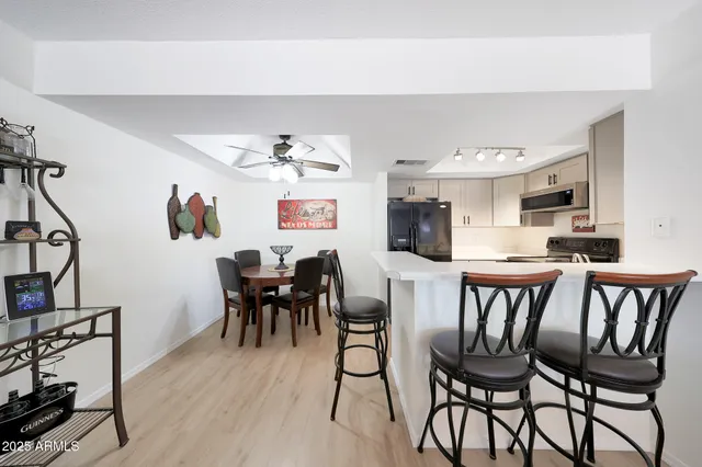 a view of a dining room with furniture and wooden floor
