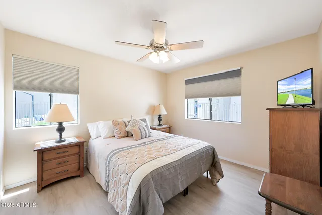 a bedroom with bed and a window