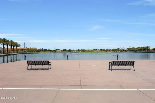 a view of a lake with a bench and lake view