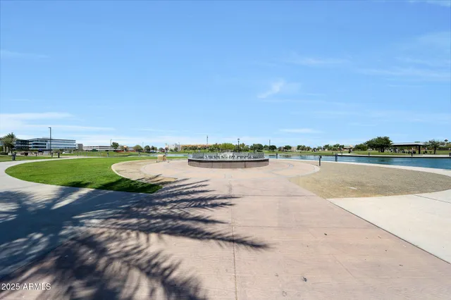 a view of a lake with houses in the back