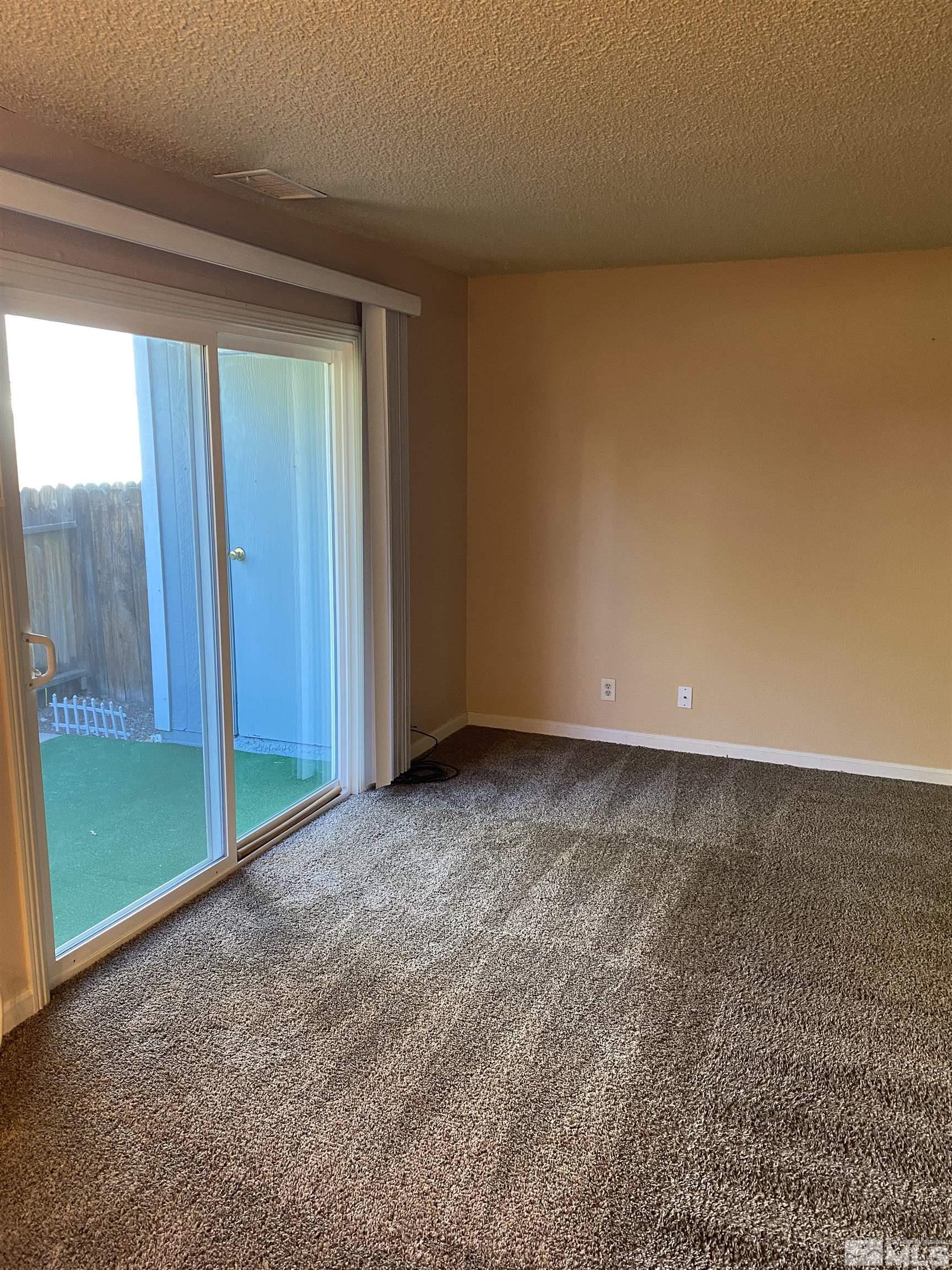 4600 Neil Road, Unit 13 Reno, NV 89502 - Photo 8 of 14 a view of an empty room and window