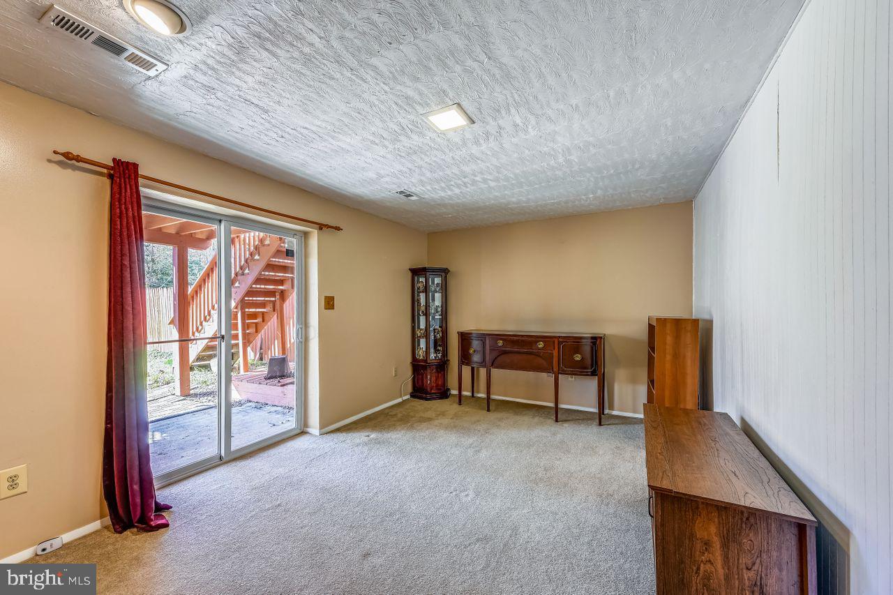355 Rambling Ridge Court Pasadena, MD 21122 - Photo 24 of 28 a view of workspace with furniture and window