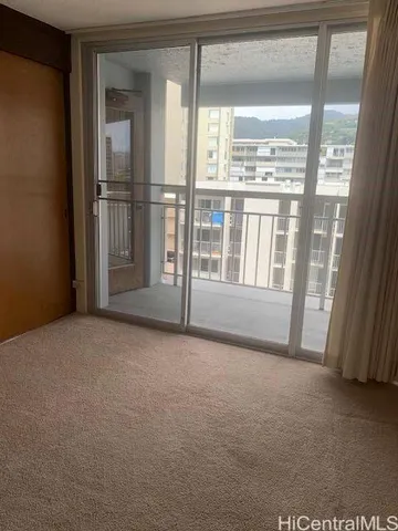 a view of empty room with floor to ceiling window