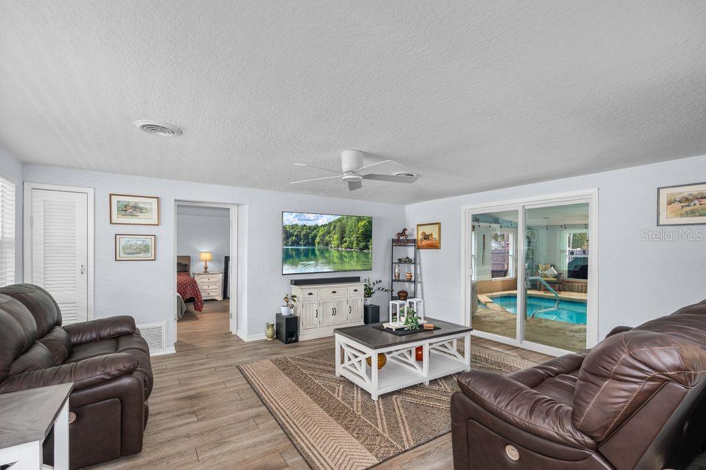 925 Flagler Avenue Edgewater, FL 32132 - Photo 11 of 35 a living room with furniture and a large window