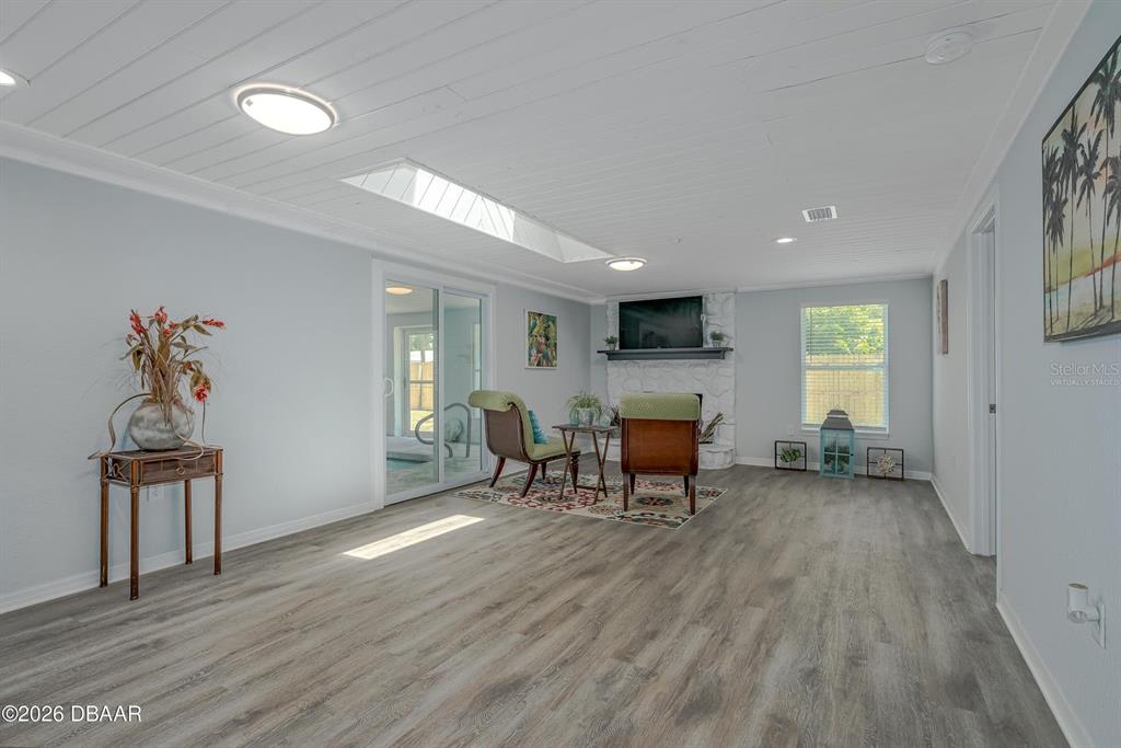 925 Flagler Avenue Edgewater, FL 32132 - Photo 17 of 35 a view of a livingroom with furniture window and wooden floor
