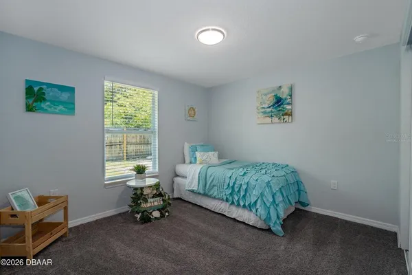a room with a bed and a window