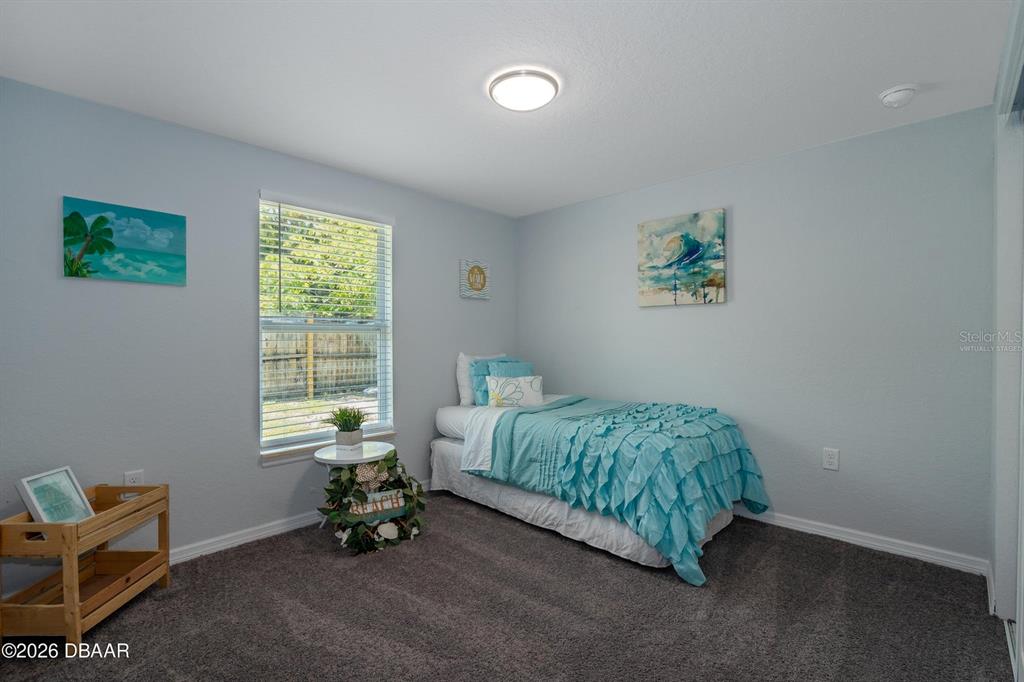 925 Flagler Avenue Edgewater, FL 32132 - Photo 20 of 35 a room with a bed and a window