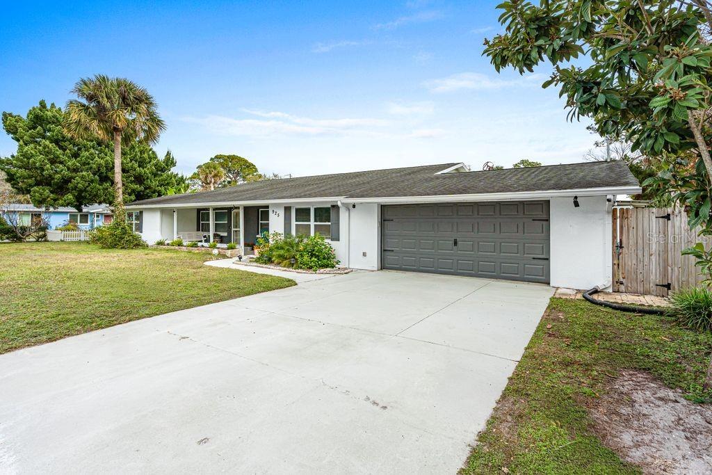 925 Flagler Avenue Edgewater, FL 32132 - Photo 2 of 35 a view of house with yard