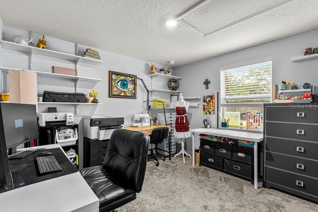 925 Flagler Avenue Edgewater, FL 32132 - Photo 23 of 35 a room with furniture and a window