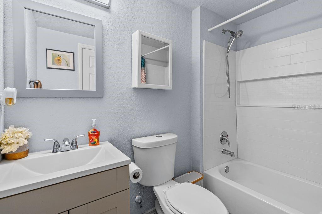 925 Flagler Avenue Edgewater, FL 32132 - Photo 26 of 35 a bathroom with a sink toilet and shower