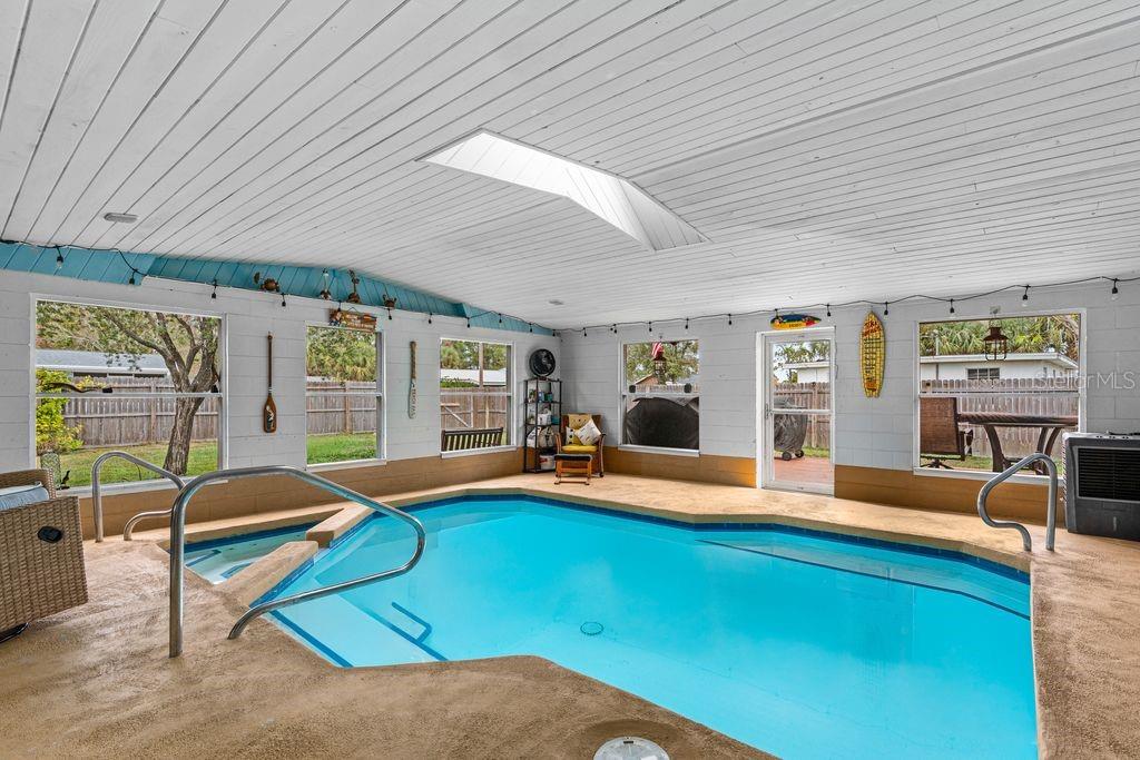 925 Flagler Avenue Edgewater, FL 32132 - Photo 3 of 35 a bedroom with furniture and a large window