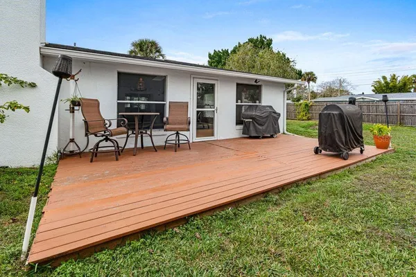 a view of a backyard with a patio