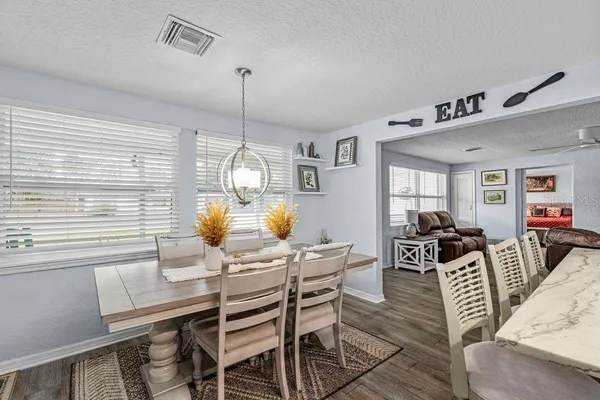 a view of a dining room with furniture window and outside view