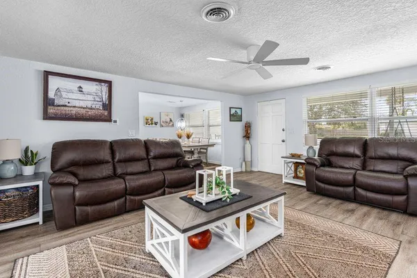 a living room with furniture and a table
