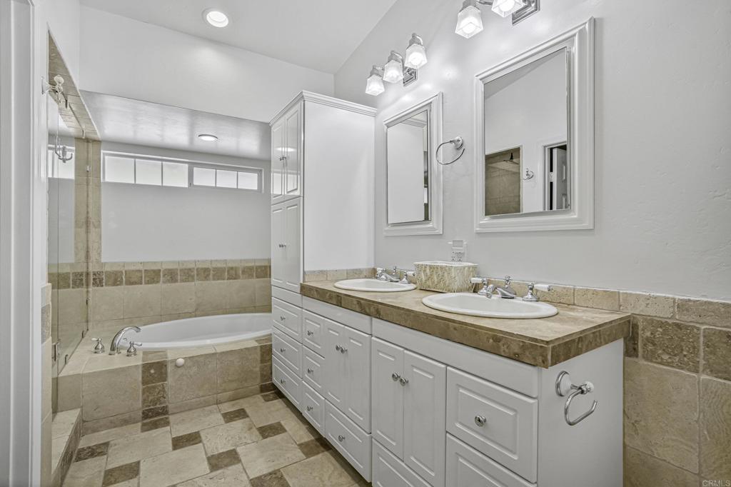 1460 Orpheus Avenue Encinitas, CA 92024 - Photo 18 of 24 a bathroom with a tub sink toilet and mirror