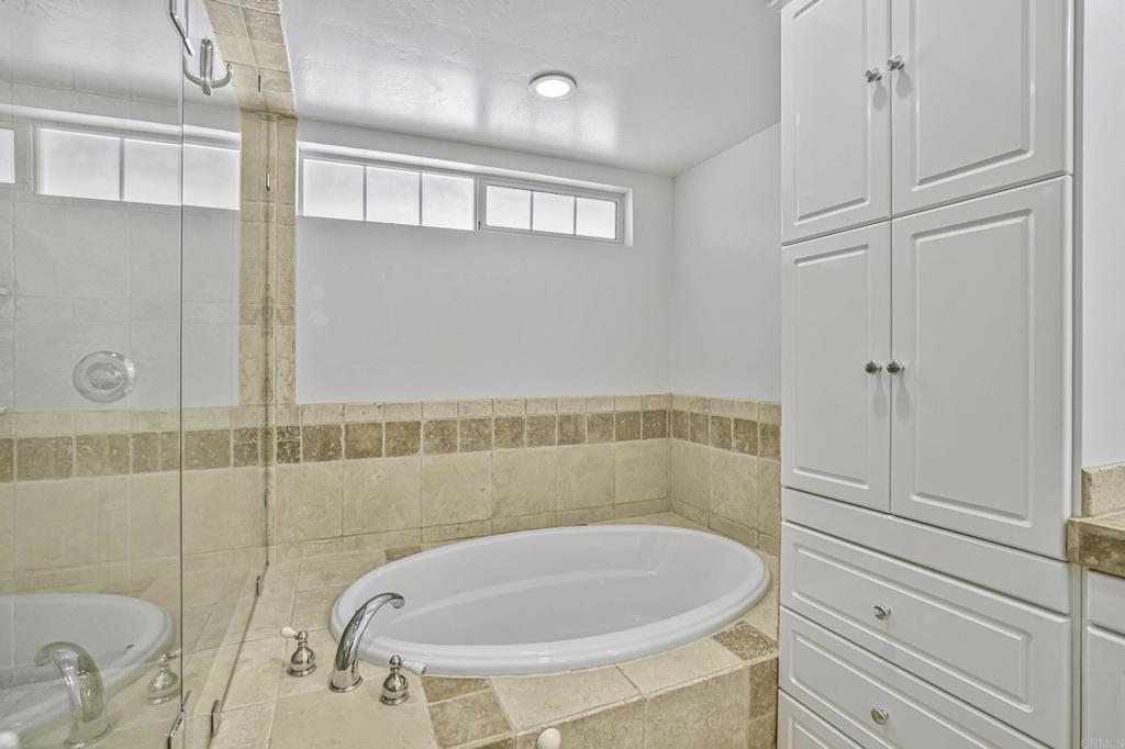 1460 Orpheus Avenue Encinitas, CA 92024 - Photo 20 of 24 a bathroom with a sink a toilet and shower