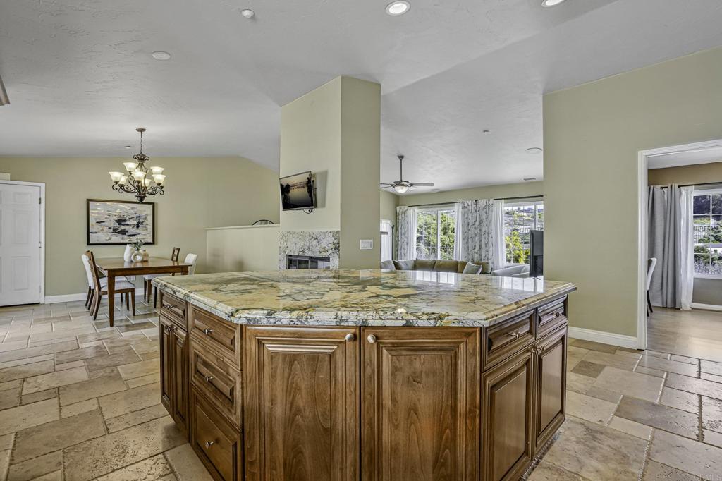 1460 Orpheus Avenue Encinitas, CA 92024 - Photo 6 of 24 a dining hall with stainless steel appliances granite countertop a sink and a refrigerator