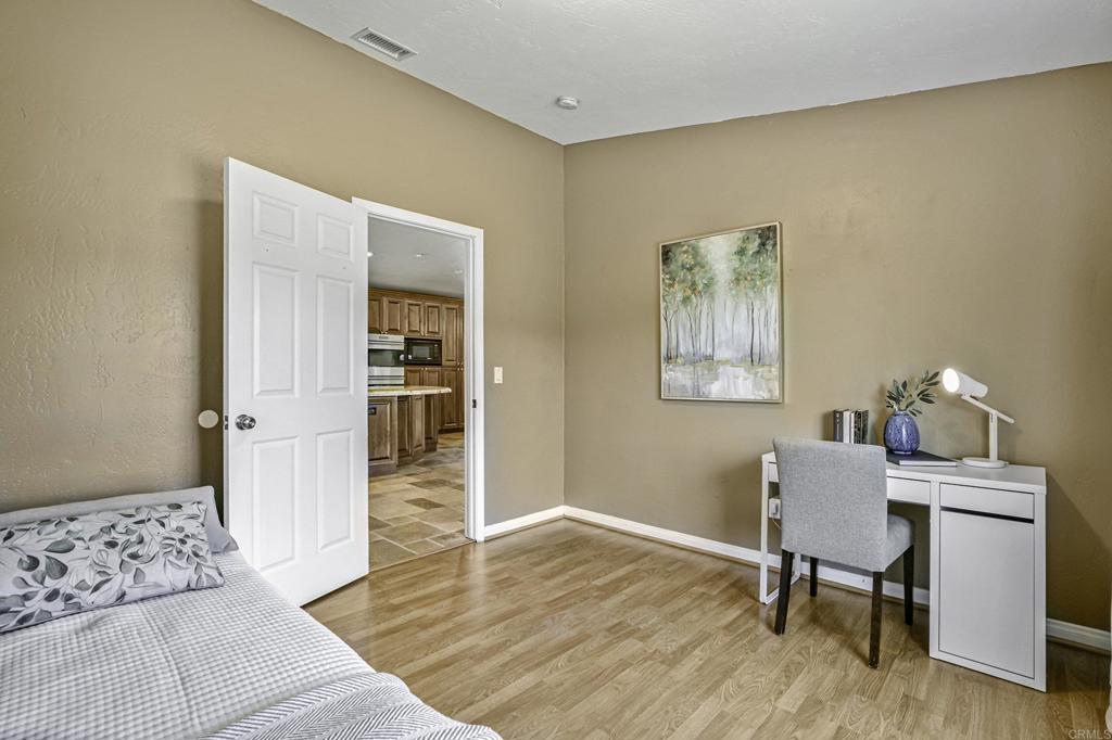 1460 Orpheus Avenue Encinitas, CA 92024 - Photo 9 of 24 a workspace room with furniture and wooden floor