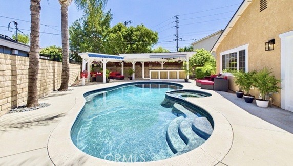 21104 Rosedell Drive Saugus, CA 91350 - Photo 2 of 33 French doors lead to this resort-style backyard with pool, spa, outdoor bar and covered living area