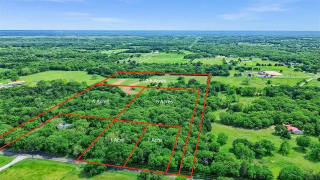 a view of a lush green space with sea