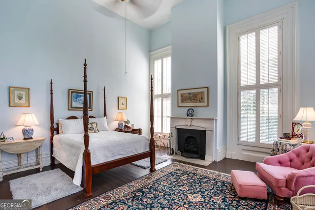 front view of a brick house with a yard