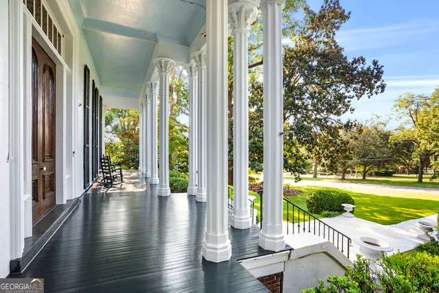 a dining room with furniture and a fireplace