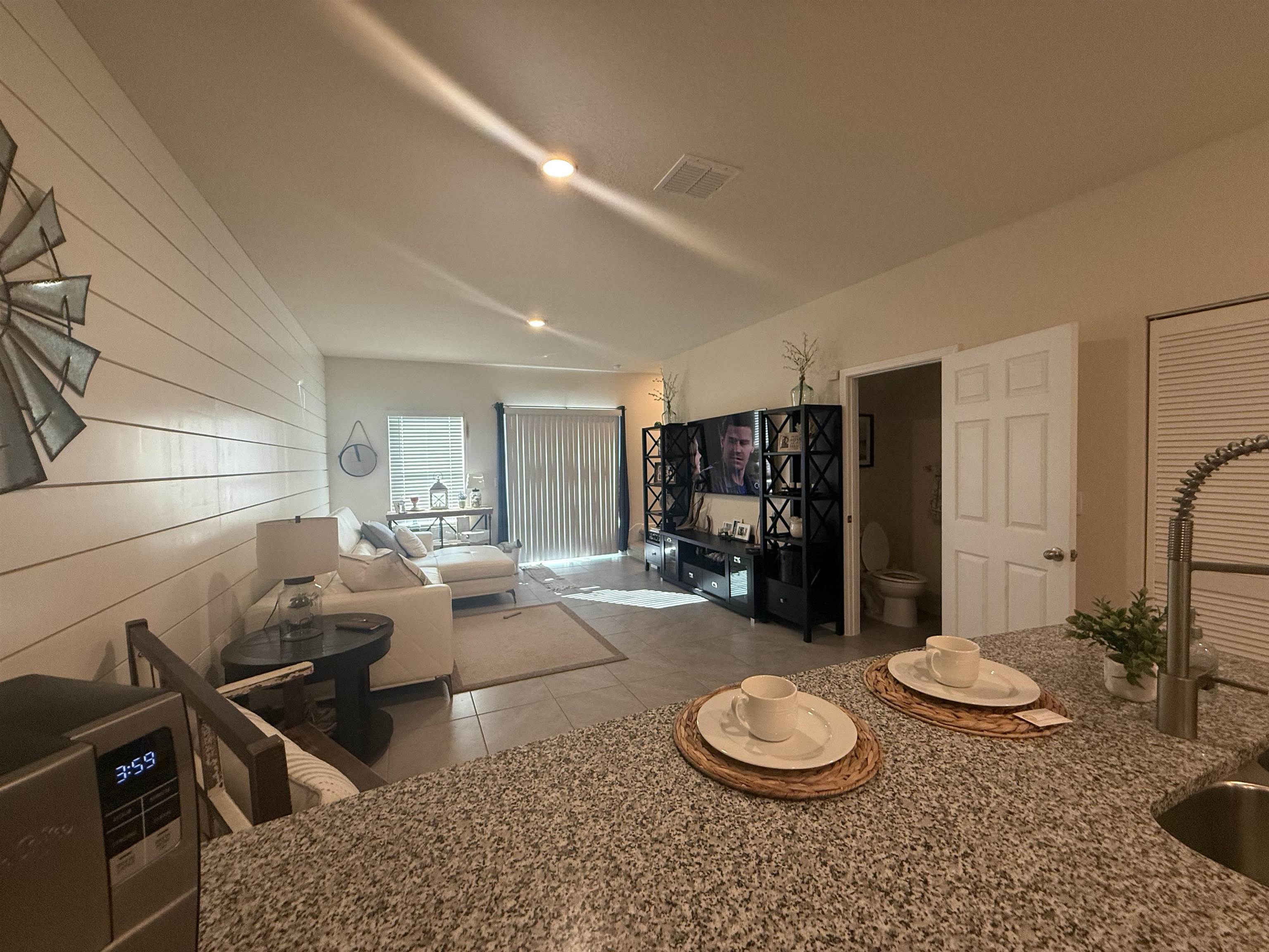 64 Coastline Way St. Augustine, FL 32092 - Photo 14 of 43 a living room with furniture and a large window