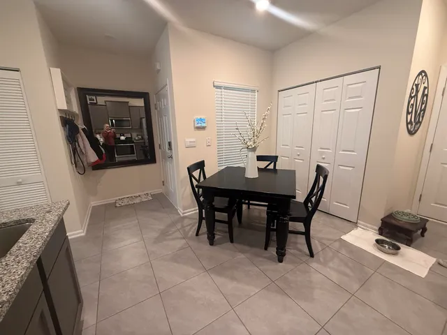 a kitchen with stainless steel appliances granite countertop a sink dishwasher stove and refrigerator