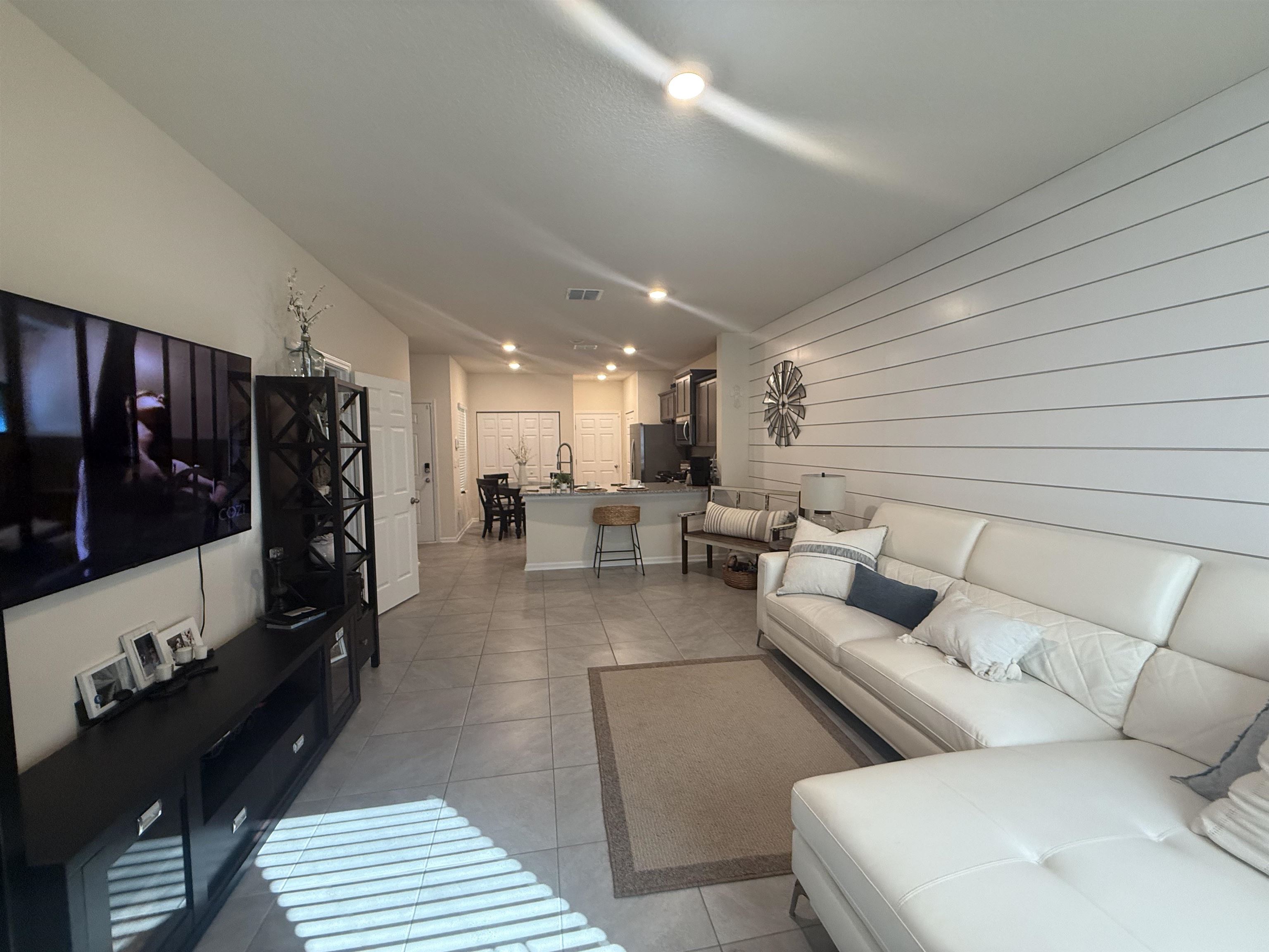 64 Coastline Way St. Augustine, FL 32092 - Photo 23 of 43 a living room with furniture and a lamp