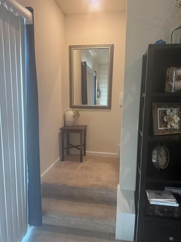 a bed room with a bed and a chair