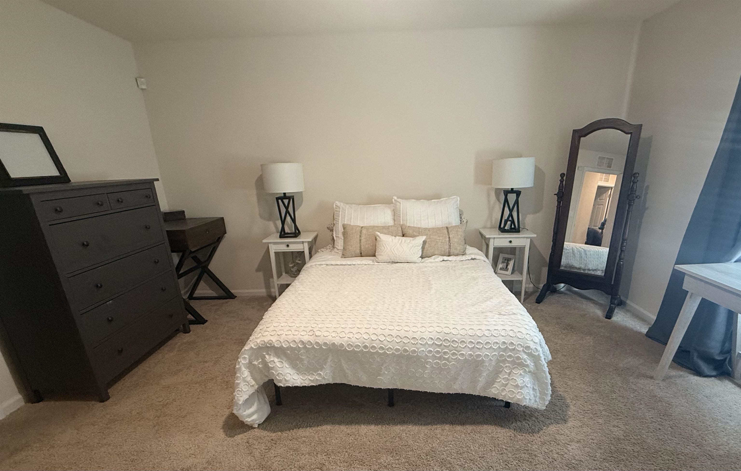 64 Coastline Way St. Augustine, FL 32092 - Photo 32 of 43 a bedroom with a bed and wooden floor