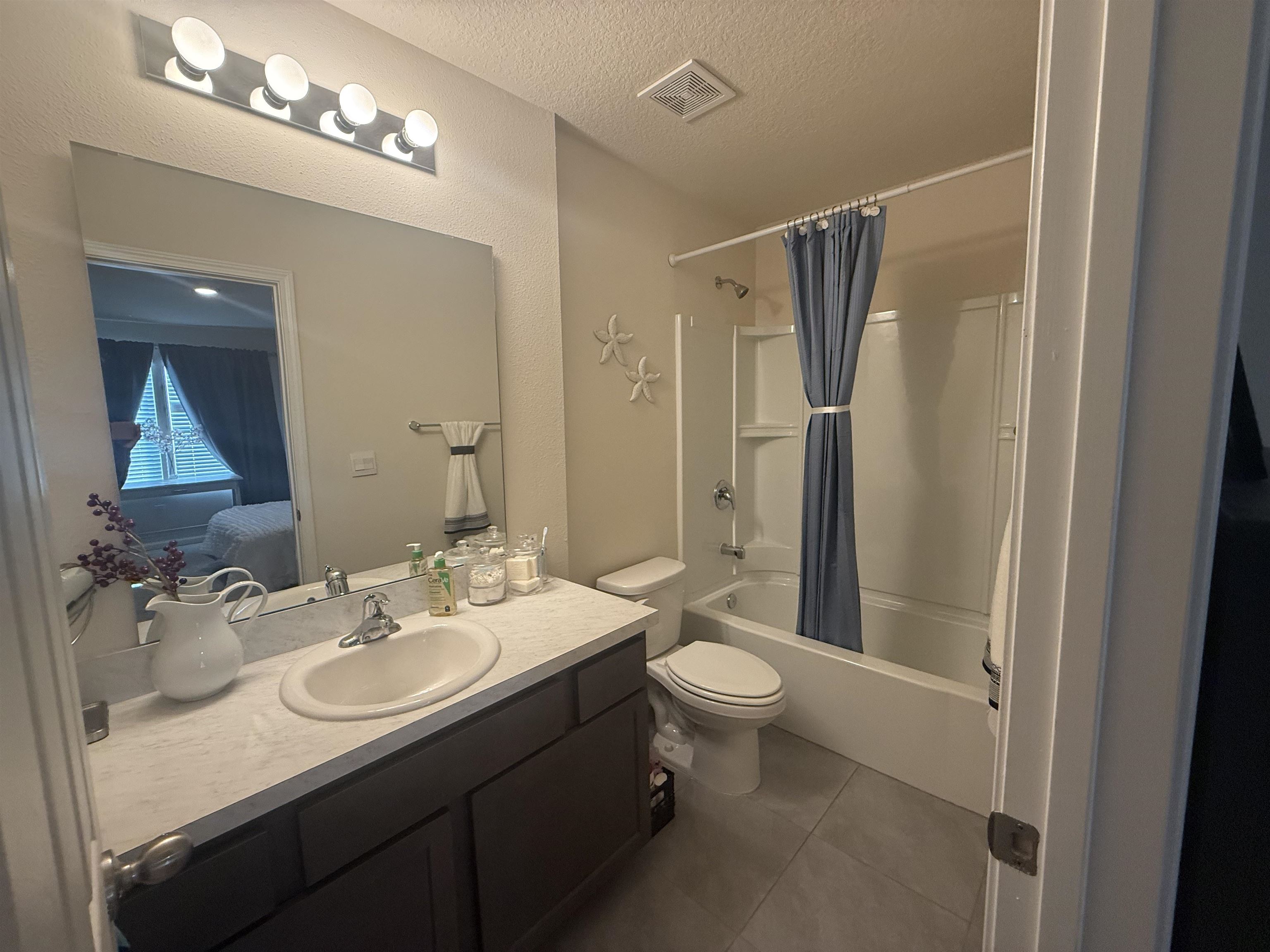 64 Coastline Way St. Augustine, FL 32092 - Photo 34 of 43 a bathroom with a sink toilet a mirror and shower