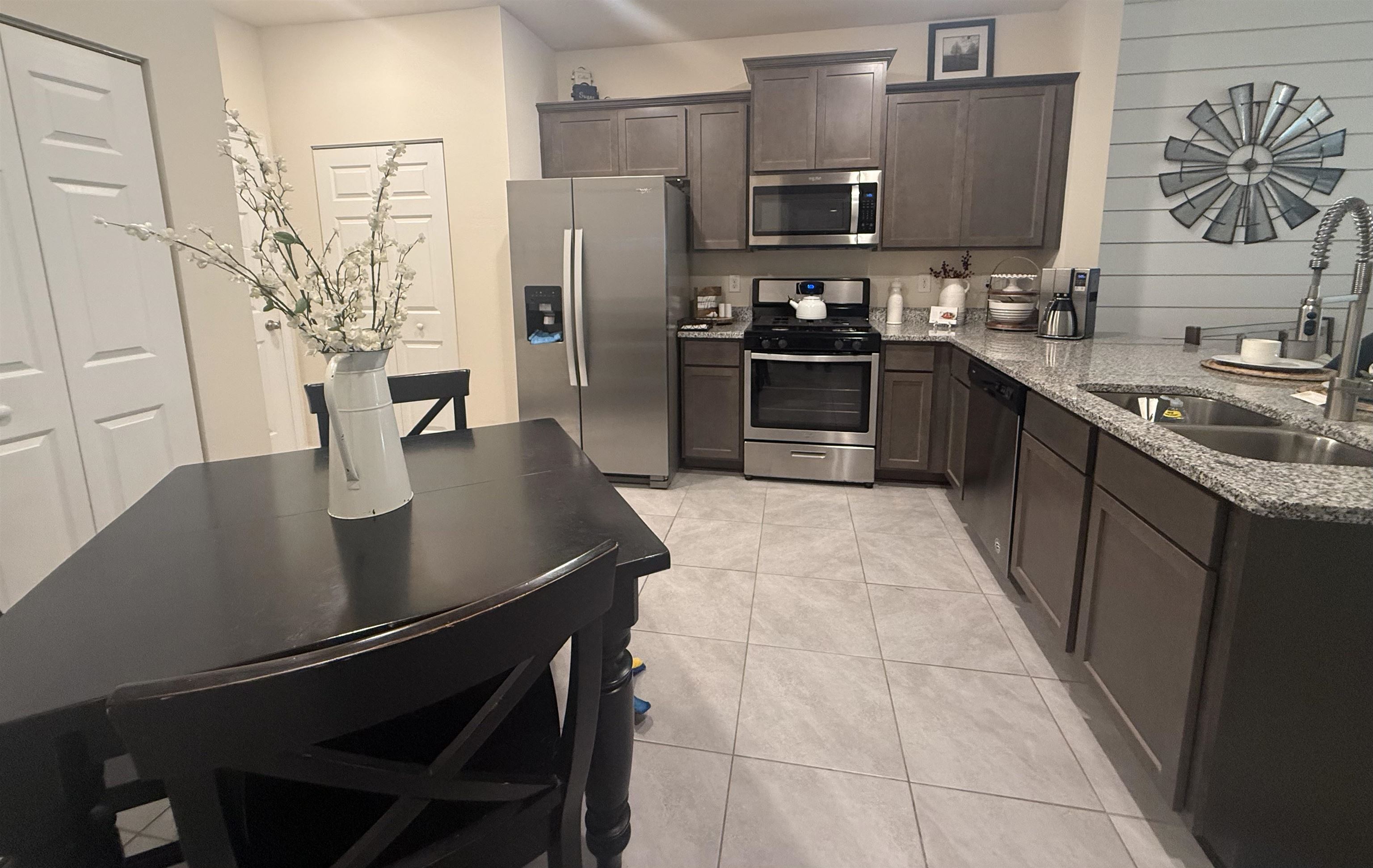 64 Coastline Way St. Augustine, FL 32092 - Photo 4 of 43 a kitchen with stainless steel appliances a sink stove and refrigerator