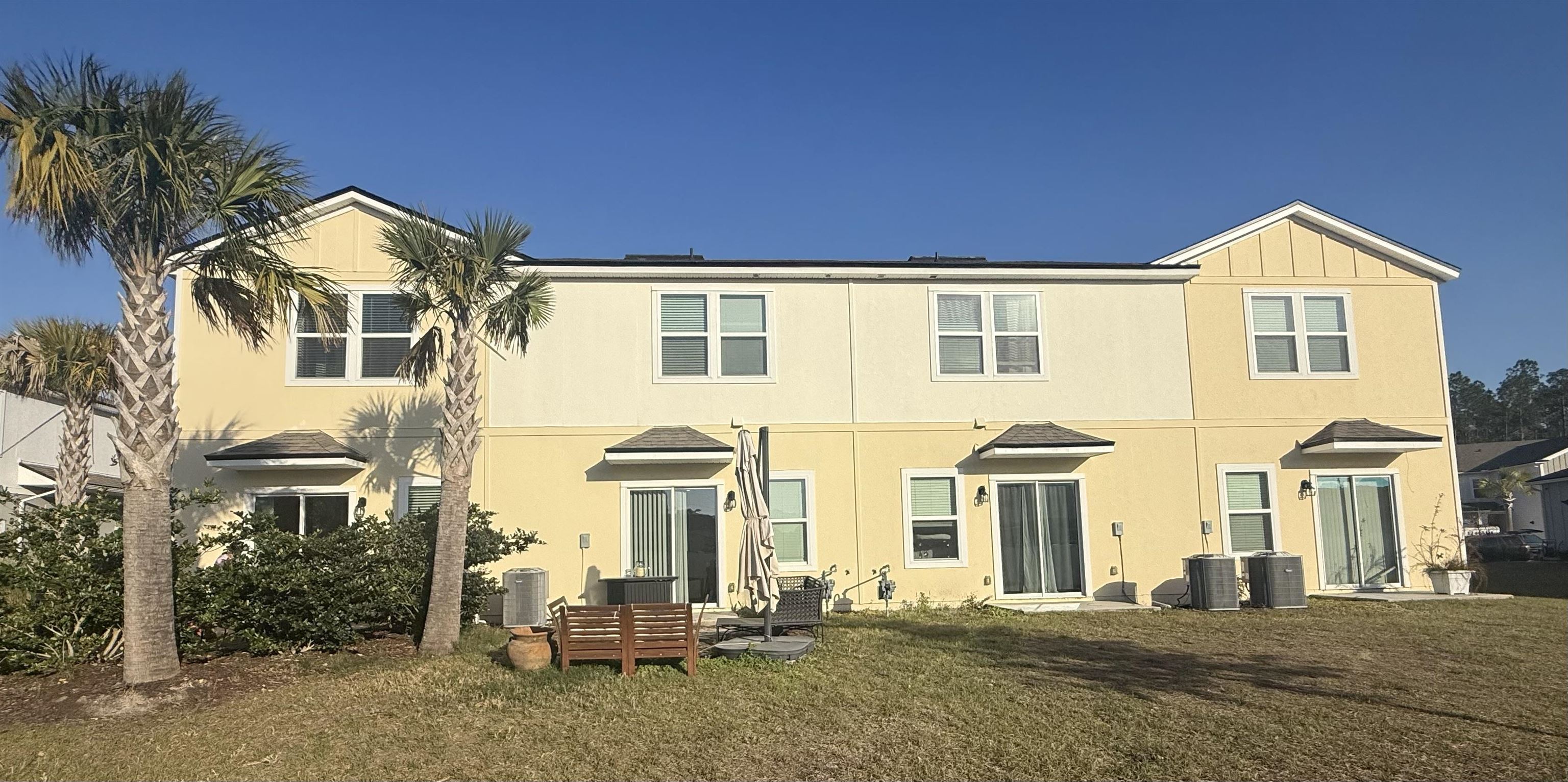64 Coastline Way St. Augustine, FL 32092 - Photo 41 of 43 a front view of a house with a yard