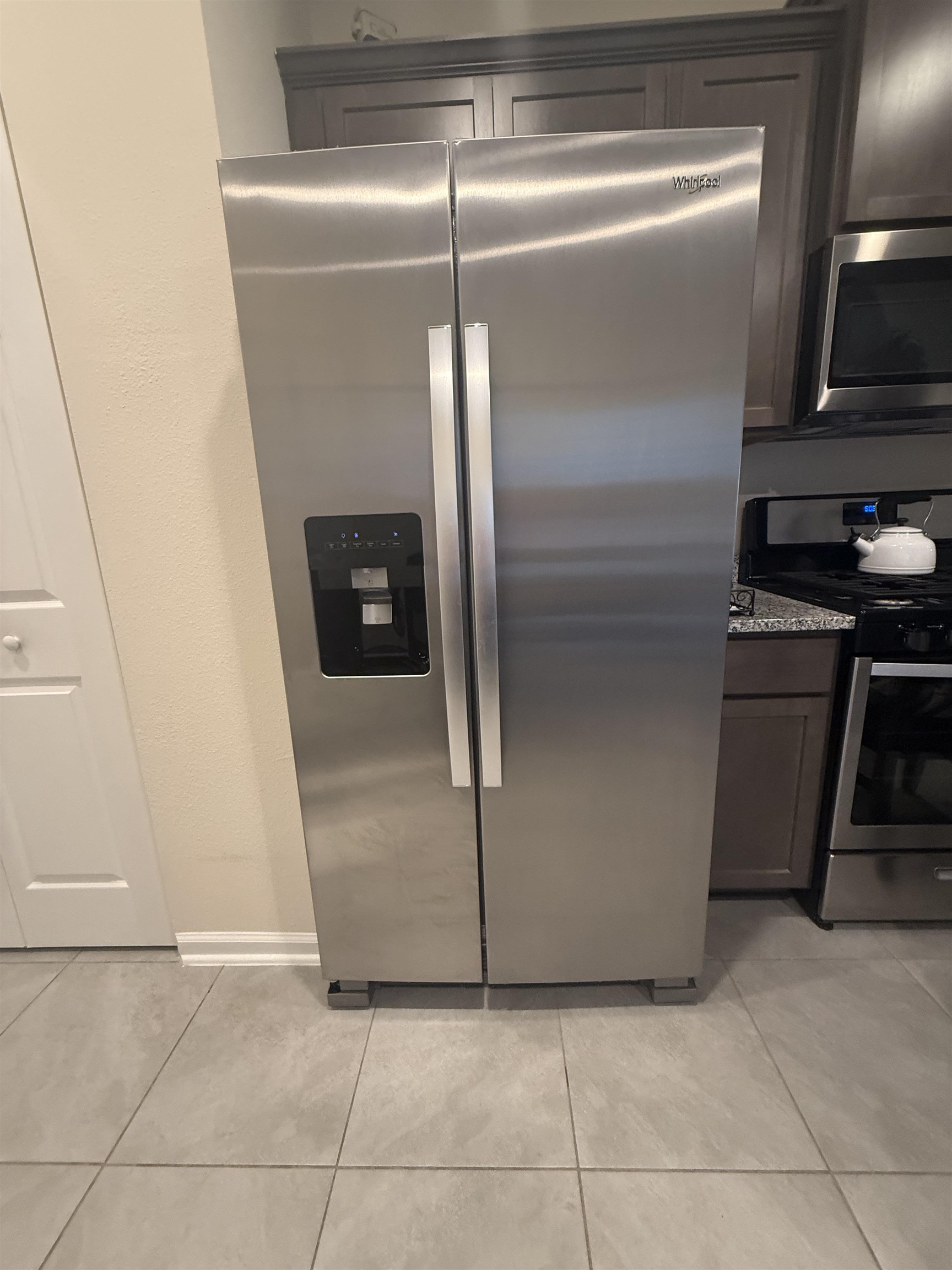 64 Coastline Way St. Augustine, FL 32092 - Photo 8 of 43 a kitchen with a refrigerator and a stove