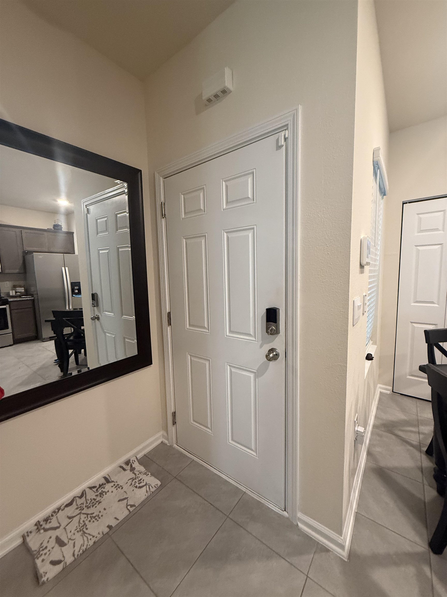64 Coastline Way St. Augustine, FL 32092 - Photo 10 of 43 a view of a hallway with wooden floor and a bathroom