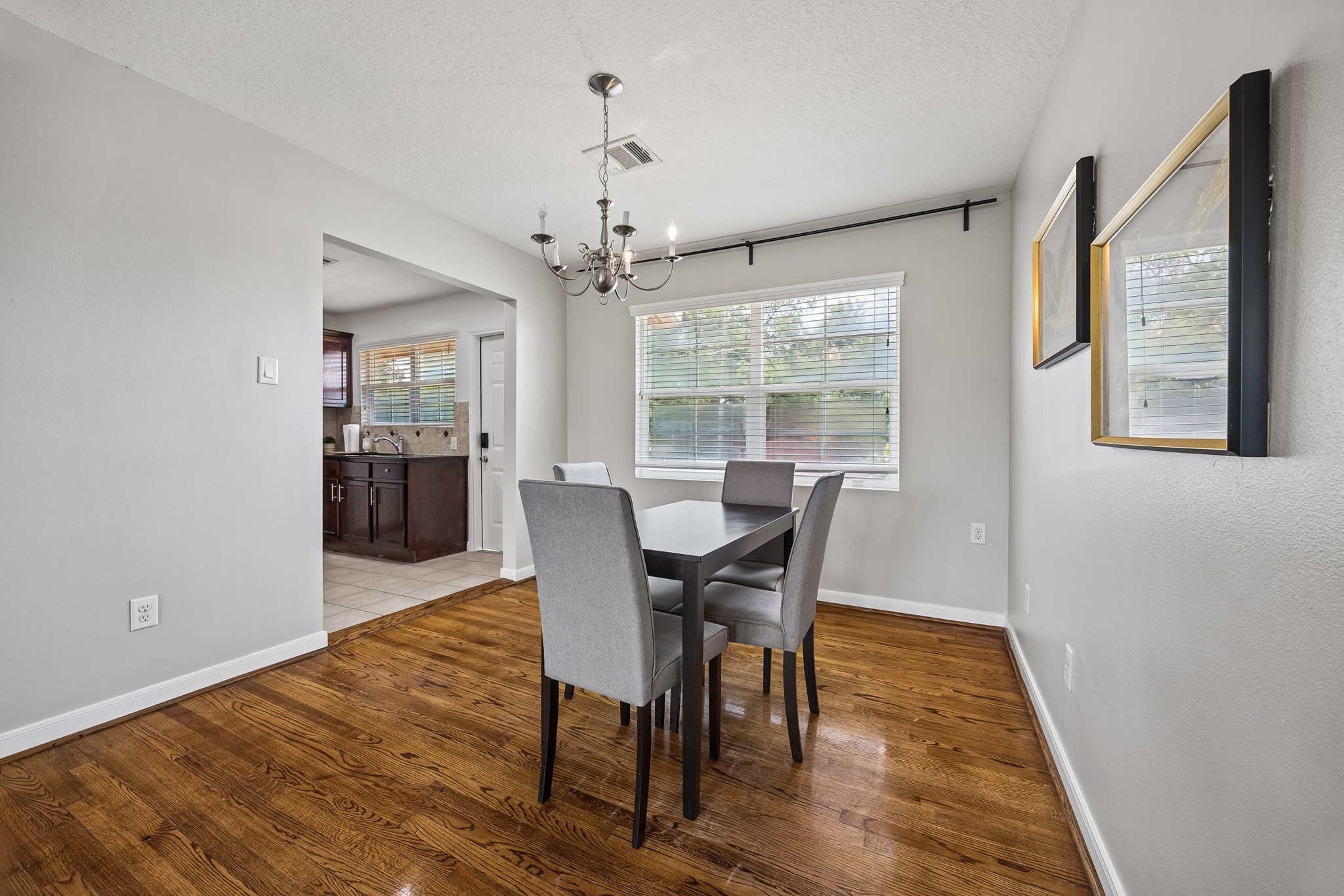 3237 Rosedale Street, Unit 4 Houston, TX 77004 - Photo 11 of 17 a view of a dining room with furniture window and wooden floor