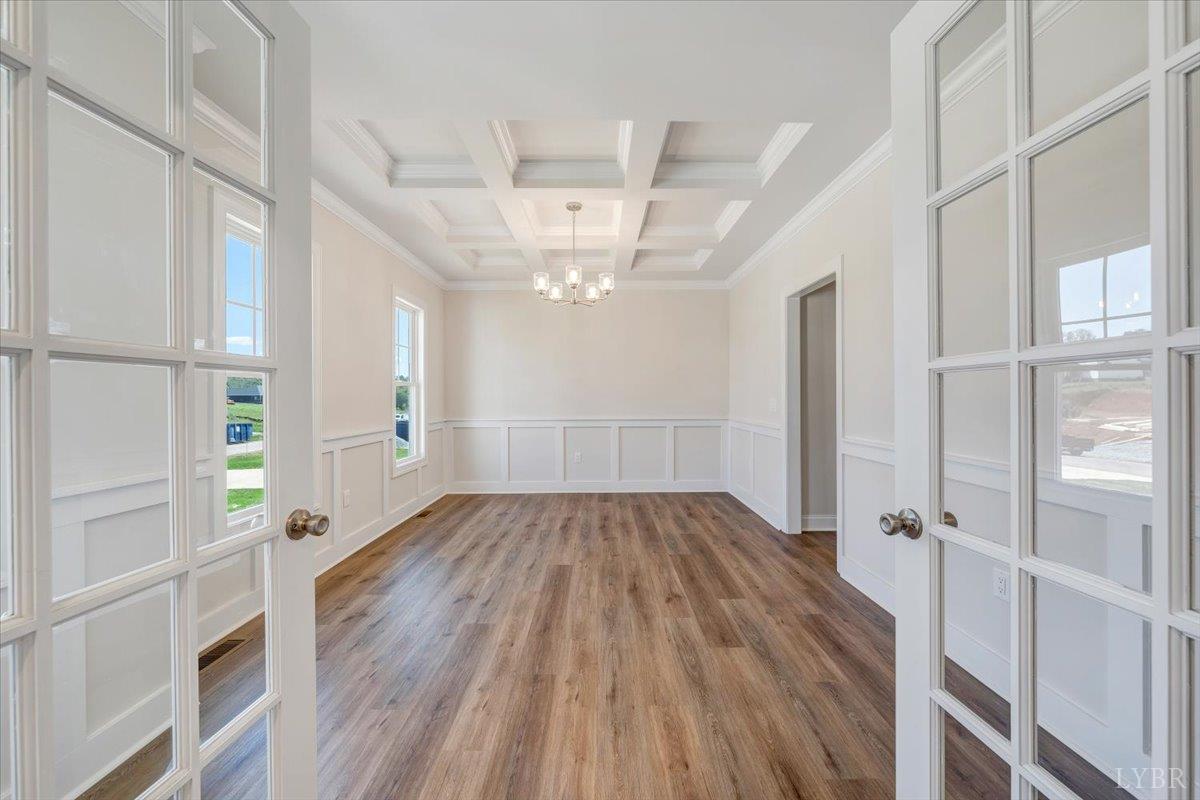 1053 Snowfield Circle Lynchburg, VA 24503 - Photo 3 of 29 wooden floor in an empty room with a window