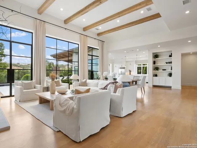 a view of a livingroom with furniture window and wooden floor