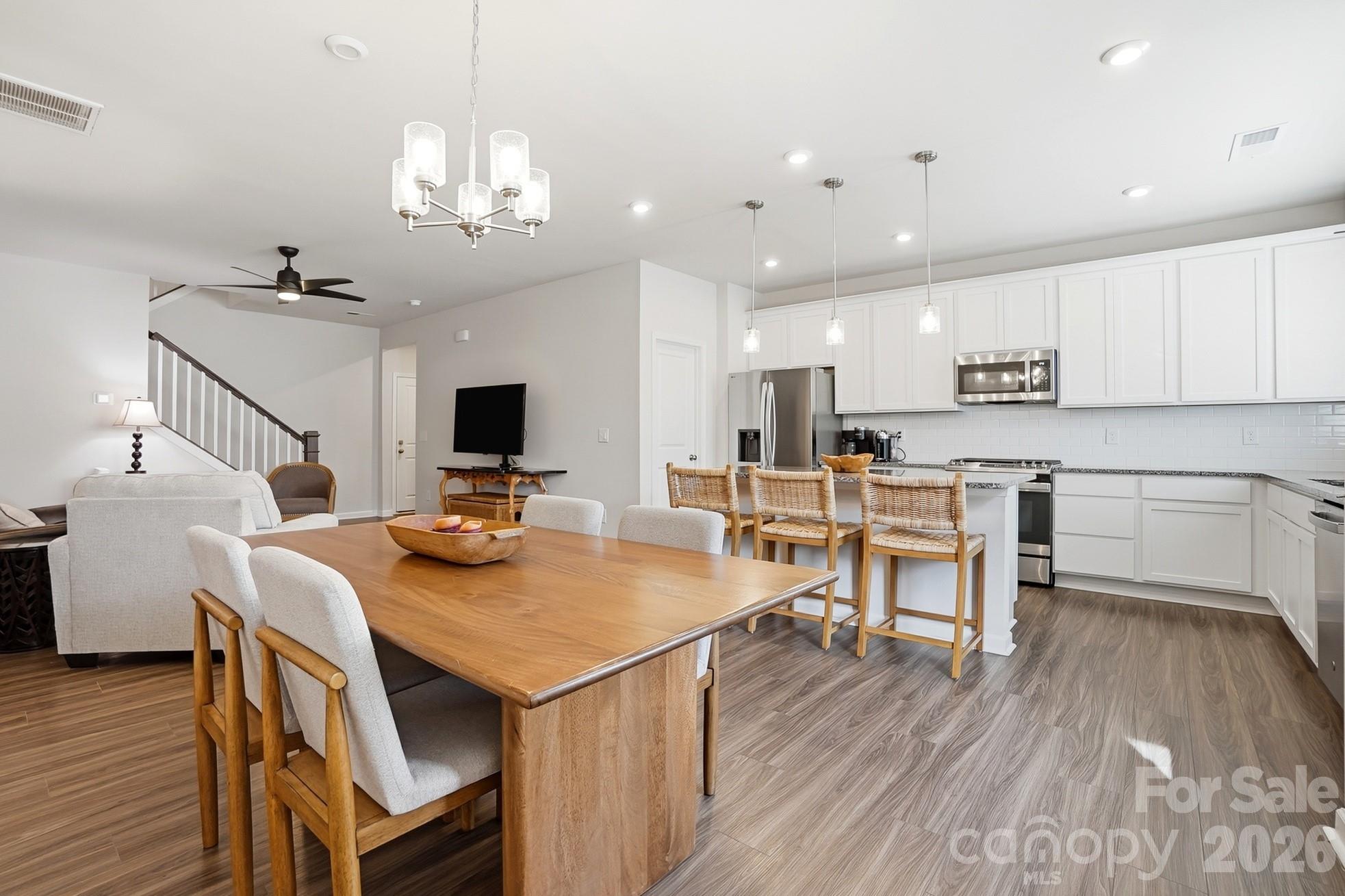 6351 Lopez Court Kannapolis, NC 28081 - Photo 16 of 48 a view of kitchen with cabinets and wooden floor