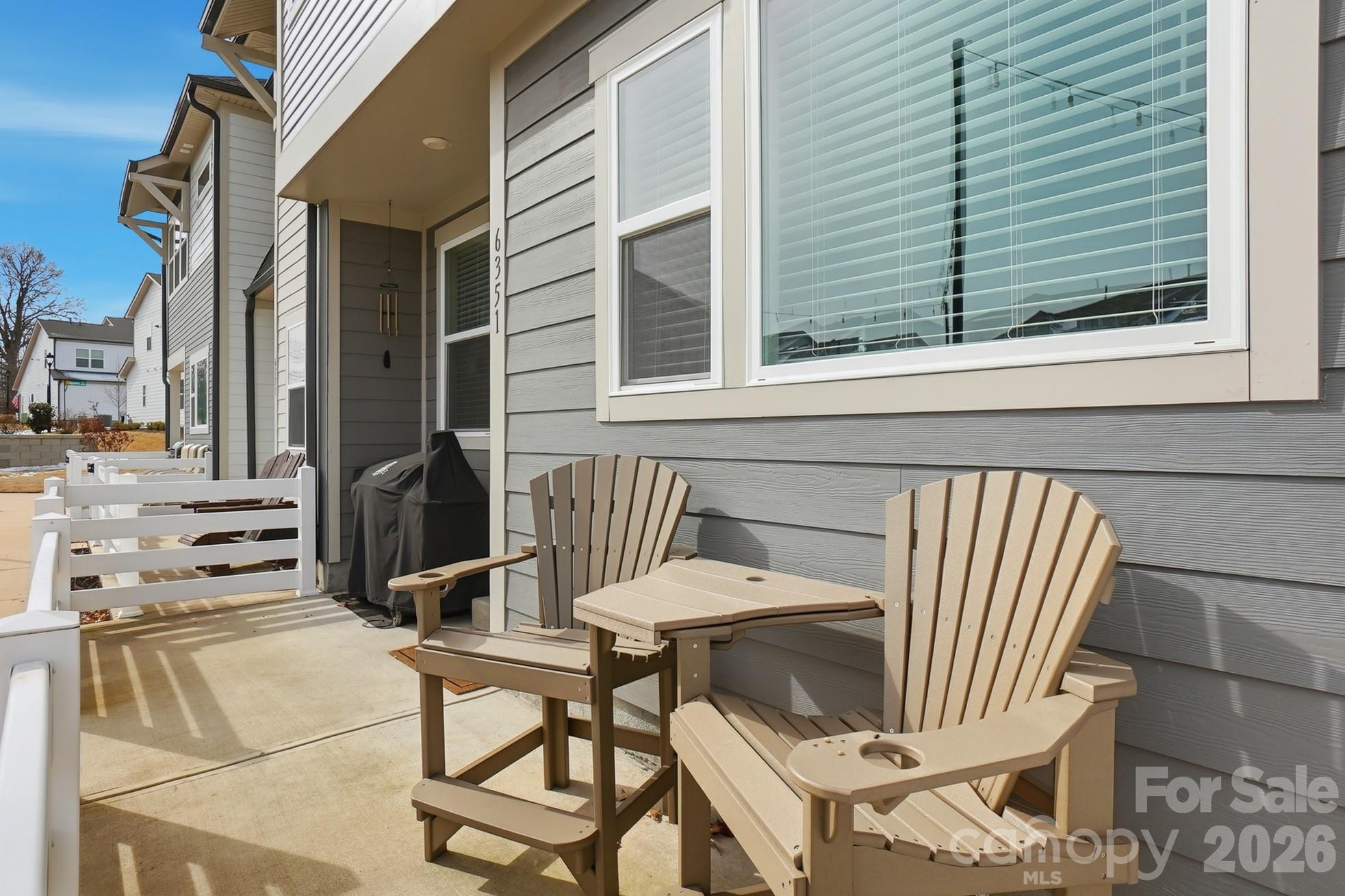 6351 Lopez Court Kannapolis, NC 28081 - Photo 2 of 48 a view of a patio with a table and chairs and potted plants