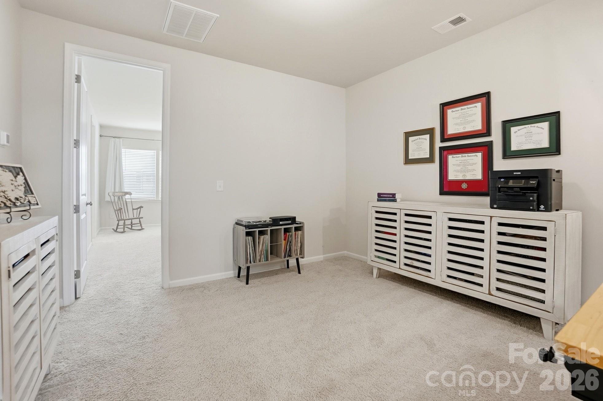 6351 Lopez Court Kannapolis, NC 28081 - Photo 21 of 48 a view of a livingroom with furniture and staircase