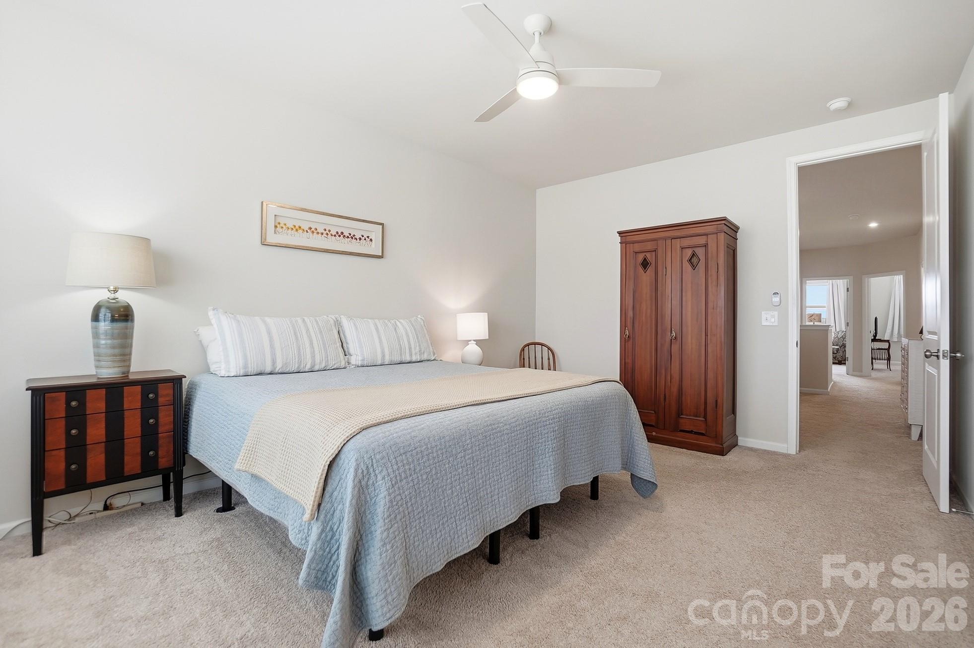 6351 Lopez Court Kannapolis, NC 28081 - Photo 24 of 48 a bedroom with a bed and a chandelier