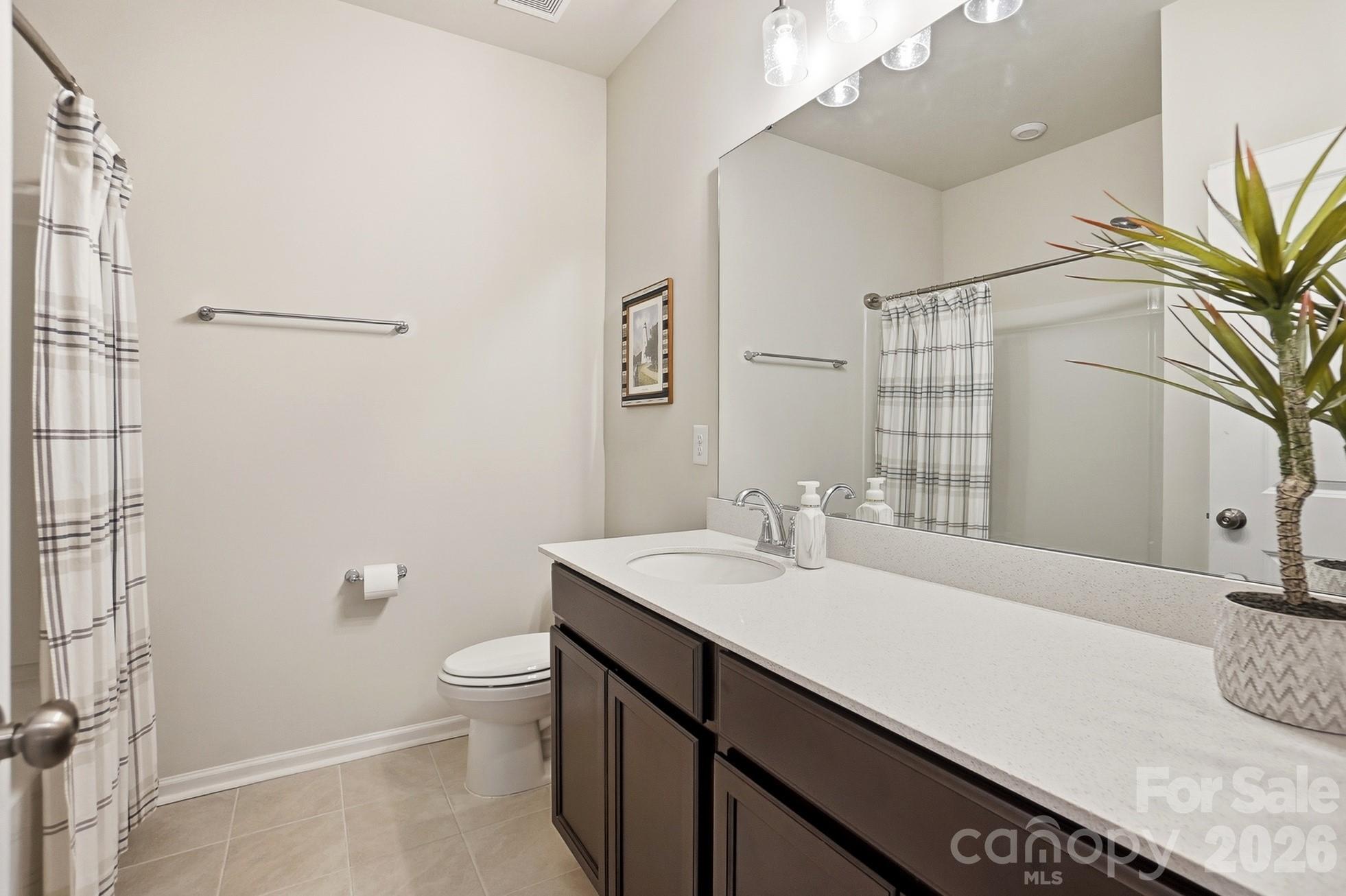 6351 Lopez Court Kannapolis, NC 28081 - Photo 31 of 48 a bathroom with a sink a toilet and shower