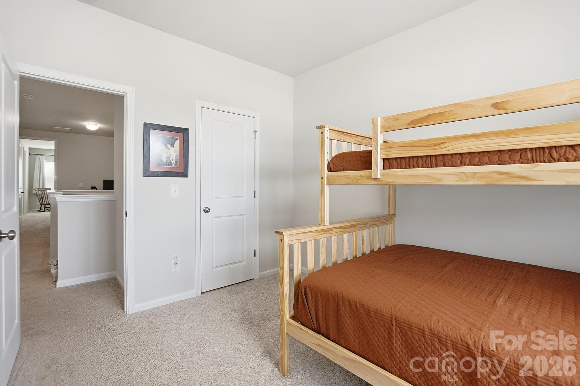 6351 Lopez Court Kannapolis, NC 28081 - Photo 34 of 48 a bedroom with a bed and cabinets