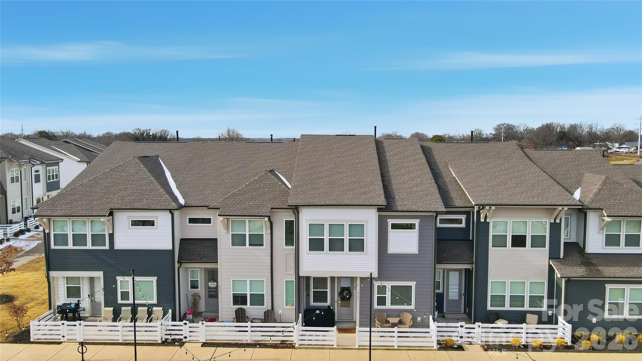 6351 Lopez Court Kannapolis, NC 28081 - Photo 39 of 48 a front view of a residential apartment building with a yard
