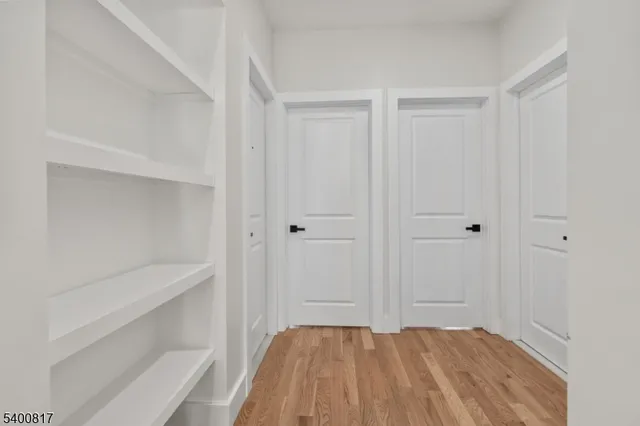 a spacious bedroom with a bed and a window