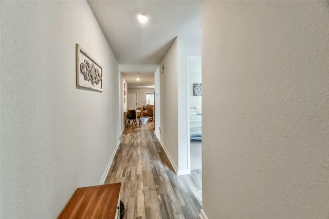 a hallway with a wooden floor